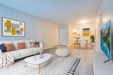 Westland apartment for rent - a living room with a couch and a coffee table and a kitchen in the background