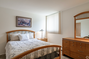 Westland apartment for rent - a bedroom with a bed and a dresser and a mirror