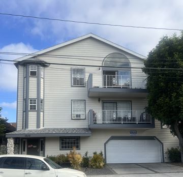 Long Beach apartment for rent - A two-story house with a balcony and a garage.