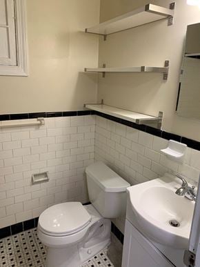 Washington apartment for rent - A white toilet and sink in a bathroom.