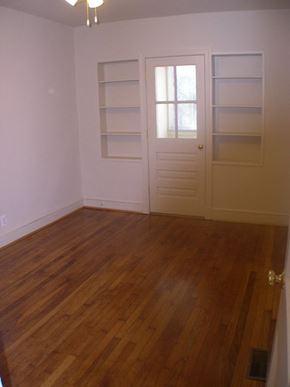 Washington apartment for rent - A room with a white door and shelves.