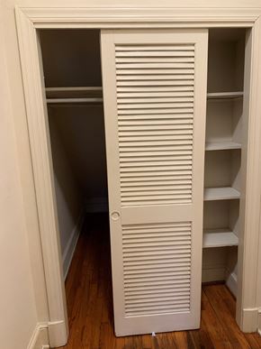 Washington apartment for rent - A white closet with shelves and a door open.
