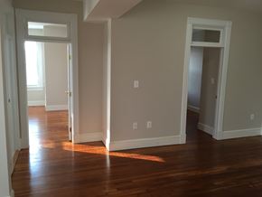 Washington apartment for rent - A room with wooden floors and white walls.