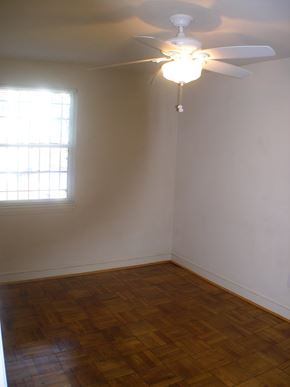 Washington apartment for rent - A room with a ceiling fan and a window.
