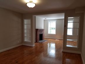 Washington apartment for rent - A room with a fireplace and a window.