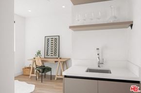 Los Angeles apartment for rent - a kitchen with a sink and a table with a chair