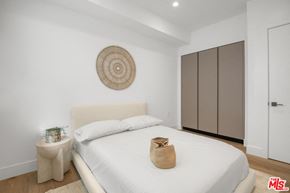 Los Angeles apartment for rent - a white bedroom with a large bed and a white wardrobe
