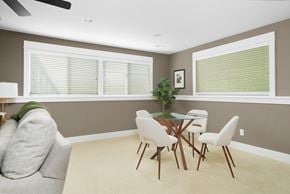 Grand Rapids house for rent - a dining room with a table and chairs and a couch
