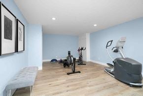 Grand Rapids house for rent - the gym is equipped with a treadmill and various exercise equipment