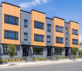 Newark apartment for rent - a row of apartment buildings on the side of a street