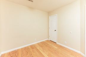 Clarksville house for rent - a bedroom with a door and a hard wood floor