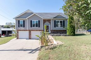 Clarksville house for rent - a house with a driveway and a garage door