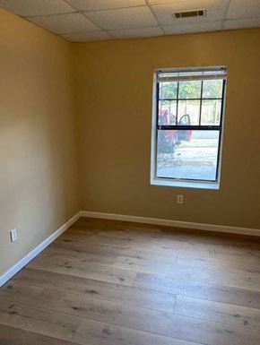 Hazen apartment for rent - A room with a window and wooden flooring.