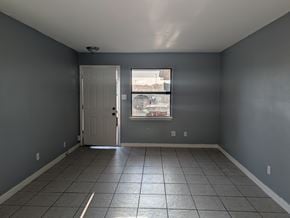 Long Beach apartment for rent - A room with grey walls and a white door.