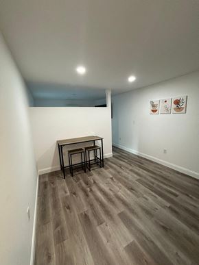Lakeland apartment for rent - A room with a wooden floor and a table in it.