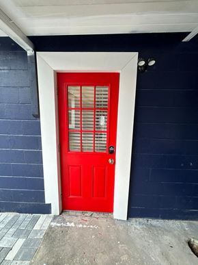 Lakeland apartment for rent - A red door with a white frame and a black handle.