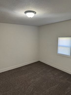 Lima house for rent - an empty room with a window and a ceiling light