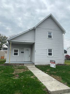 Lima house for rent - a white house with a foreclosure sign in front of it