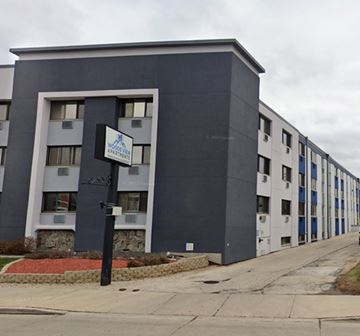 Milwaukee apartment for rent - a building with a street sign in front of it