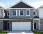 Waukee apartment for rent - A two-story house with a garage.