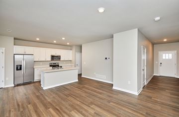 Waukee apartment for rent - A kitchen with a refrigerator, stove, and oven.