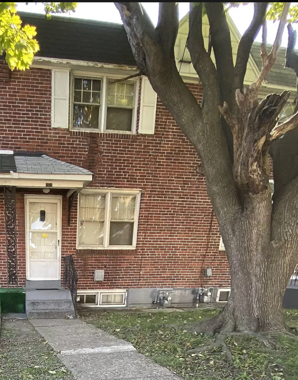 Chester apartment for rent - A tree in front of a brick house.