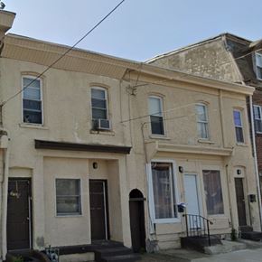 Chester apartment for rent - A row of houses with dark front doors.