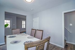 Collingswood apartment for rent - A dining room with a white table and chairs.