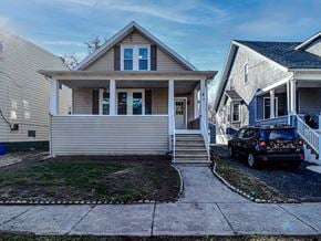 Collingswood apartment for rent - A house with a car parked in front.