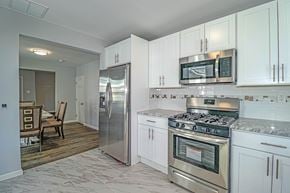 Collingswood apartment for rent - A kitchen with white cabinets and stainless steel appliances.
