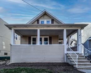 Collingswood apartment for rent - A house with a covered front porch and a staircase leading to the entrance.