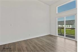 West Des Moines apartment for rent - A room with a sliding glass door leading to a balcony.