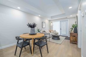 Winnipeg apartment for rent - A modern dining room with a round table and chairs.