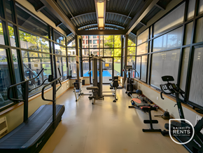 Vancouver apartment for rent - A gym with treadmills, exercise bikes and other equipment.