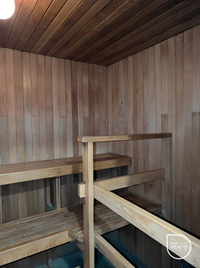 Vancouver apartment for rent - A wooden sauna with benches and a ladder.