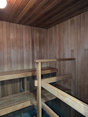 Vancouver apartment for rent - A wooden sauna with benches and a ladder.