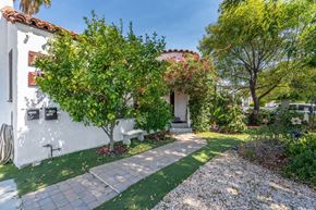 North Hollywood house for rent - a garden outside a white house with a pathway and trees