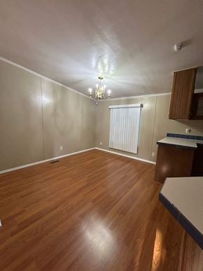 Harker Heights house for rent - an empty living room with wood floors and a window