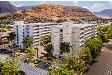 Waianae apartment for rent - an aerial view of an apartment complex with a mountain in the background
