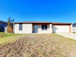 Killeen house for rent - a white brick house with a driveway and a garage door