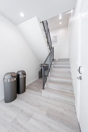 Los Angeles apartment for rent - a long staircase leading up to a white room with white walls and a stairwell