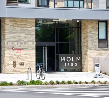 Washington apartment for rent - a city street with a bike parked in front of a building