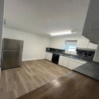 Lakeland apartment for rent - an empty kitchen with a stainless steel refrigerator