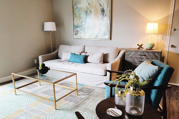 Omaha apartment for rent - a living room with a couch and a coffee table
