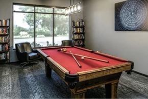 Omaha apartment for rent - a games room with a red pool table