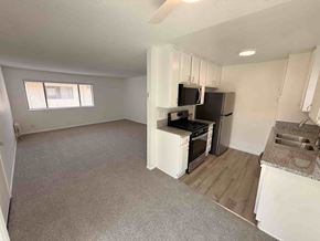 Long Beach apartment for rent - A kitchen area with a stove, microwave, and oven.