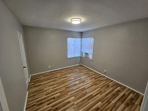 Pico Rivera apartment for rent - a living room with a hard wood floor and a window