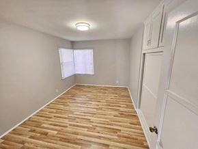 Pico Rivera apartment for rent - a room with a hard wood floor and a window