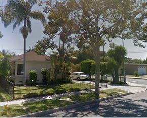 Pico Rivera apartment for rent - a house with palm trees and a white car on a street