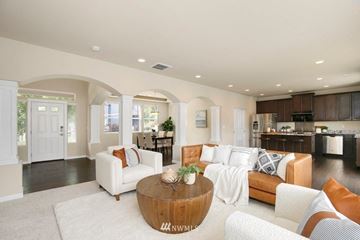 Seattle house for rent - A living room with a white couch and a coffee table.
